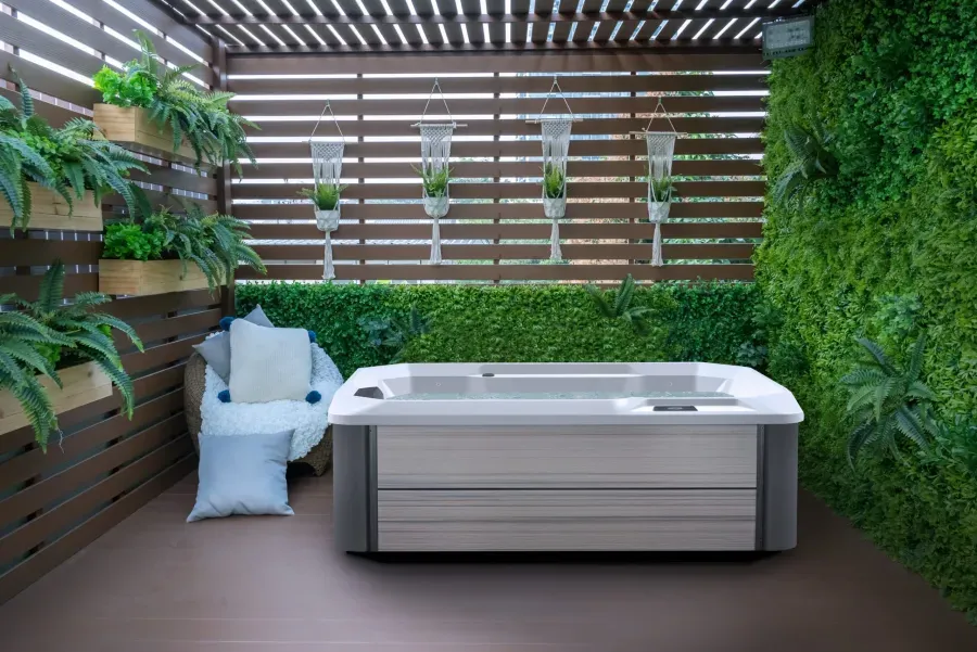 In-ground pool and attached spa with circulating water features